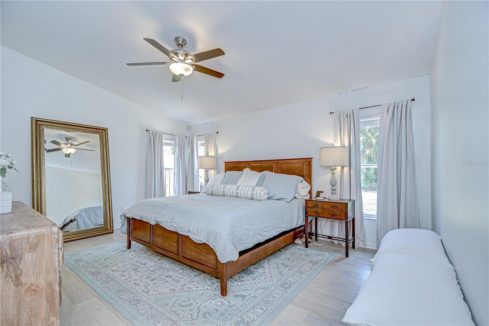 Bright and spacious primary suite with natural light.