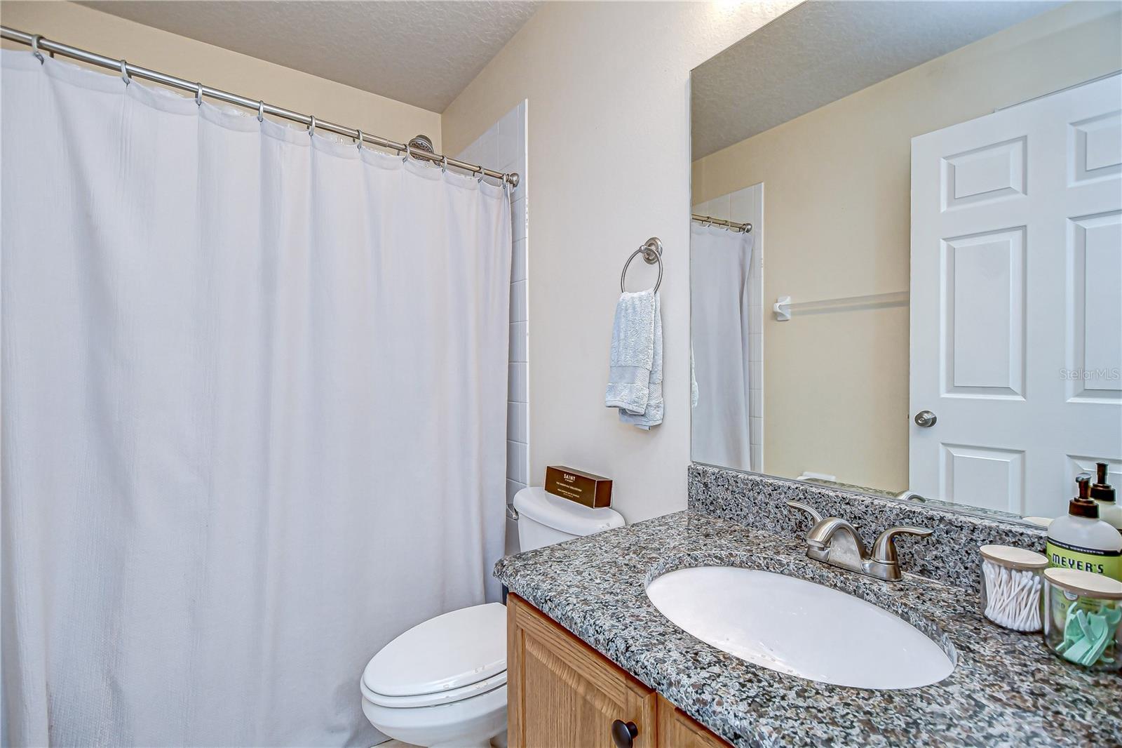 Updated bathroom with granite countertops (2019).