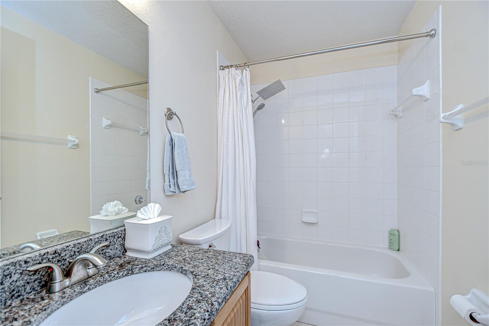 Private bathroom attached to additional bedroom.