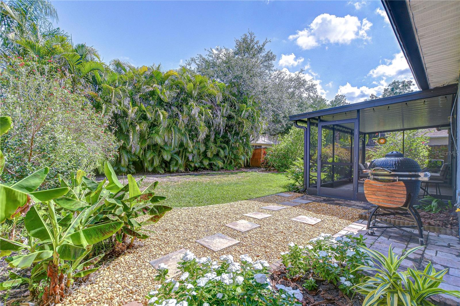 Mature back landscaping and well-maintained lawn. Great for outdoor activities.