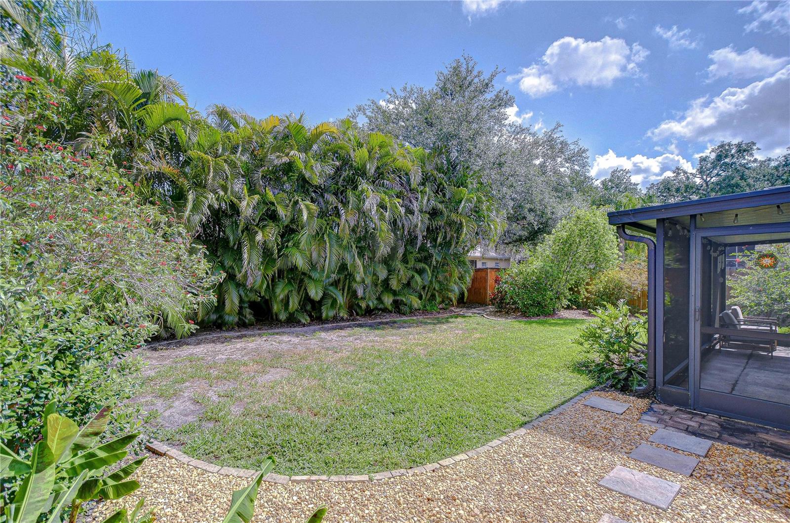 Spacious backyard offering privacy and room for pets or outdoor activities.