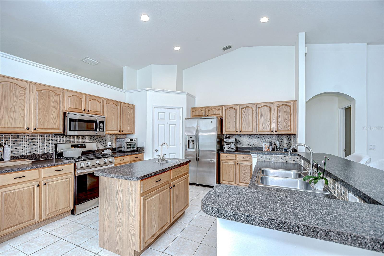 Functional island workspace with abundant cabinetry.
