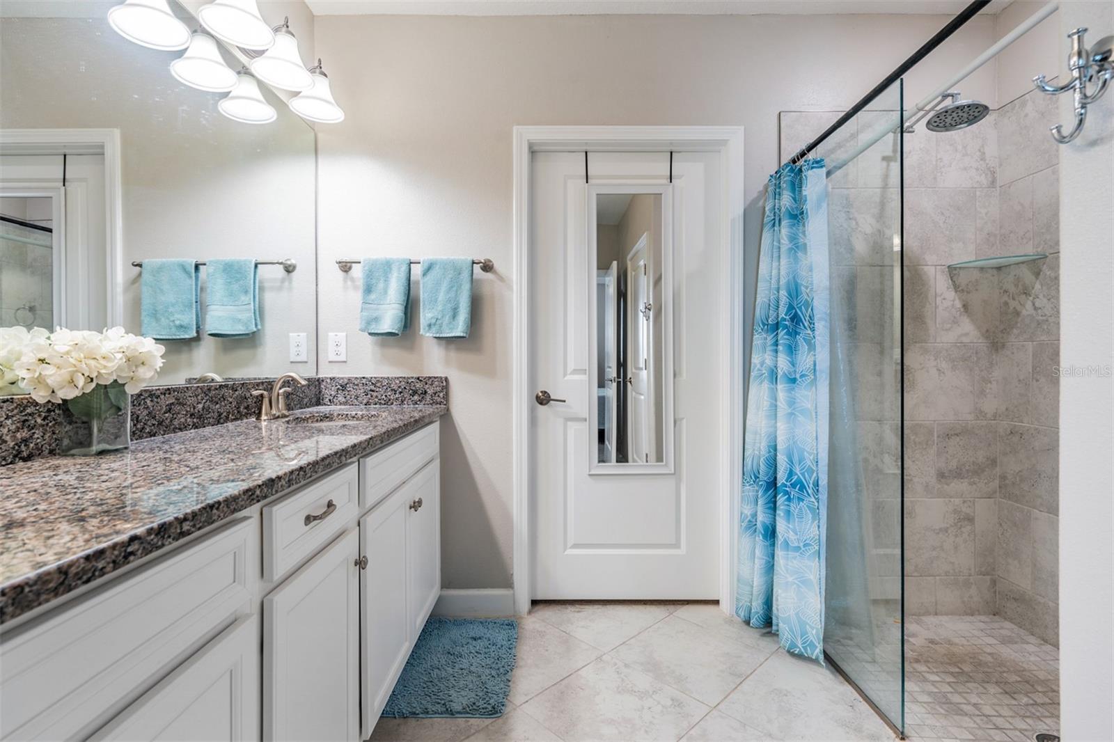 Bath ensuite boasts massive shower and dual sinks