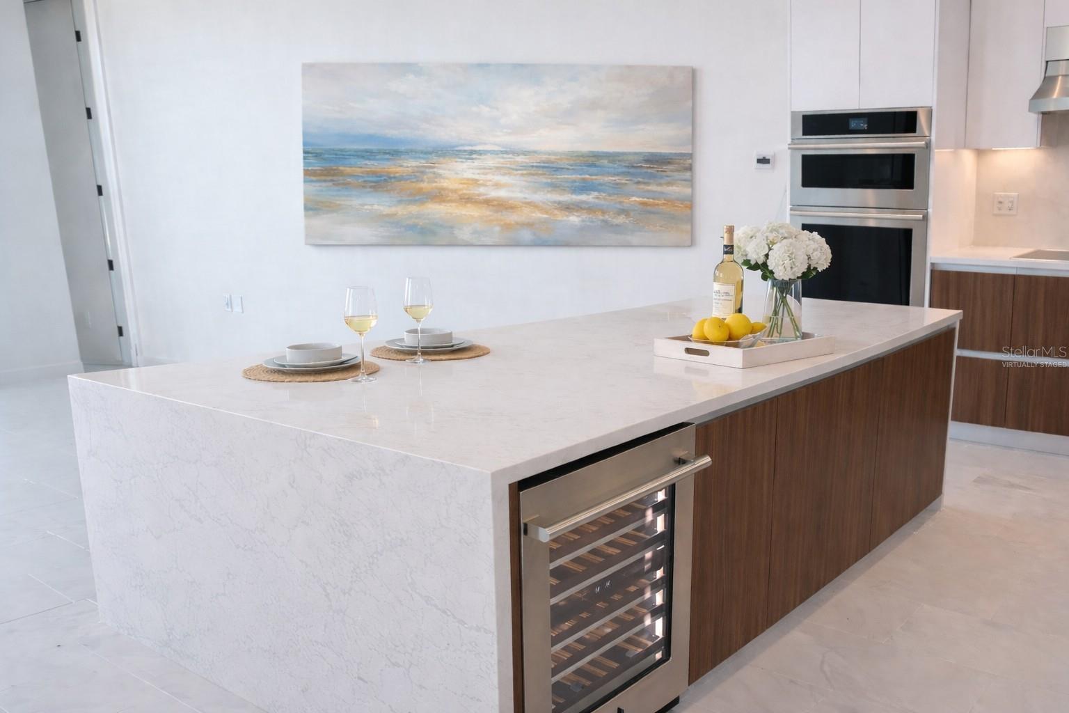 Waterfall Quartz Island  / Breakfast Bar / Kitchen with Stainless Steel Jenn Beverage / Wine Fridge - Virtually Staged