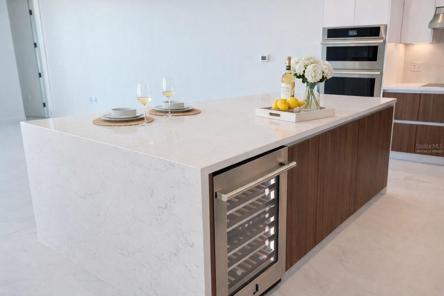 Waterfall Quartz Island  / Breakfast Bar / Kitchen with Stainless Steel Jenn Beverage / Wine Fridge - Virtually Staged