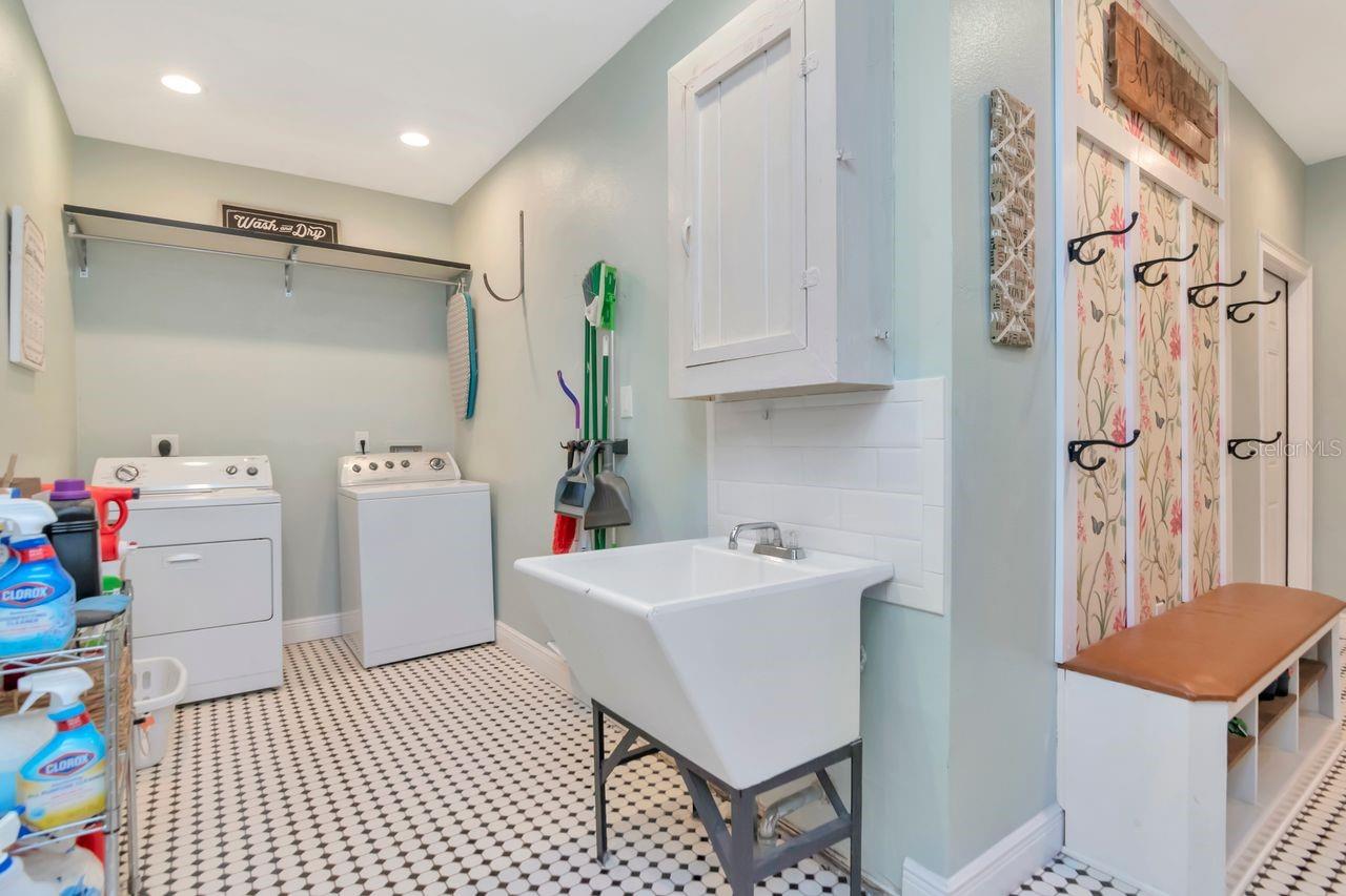 Inside Laundry with Washer, Dryer, Utility Sink & Storage