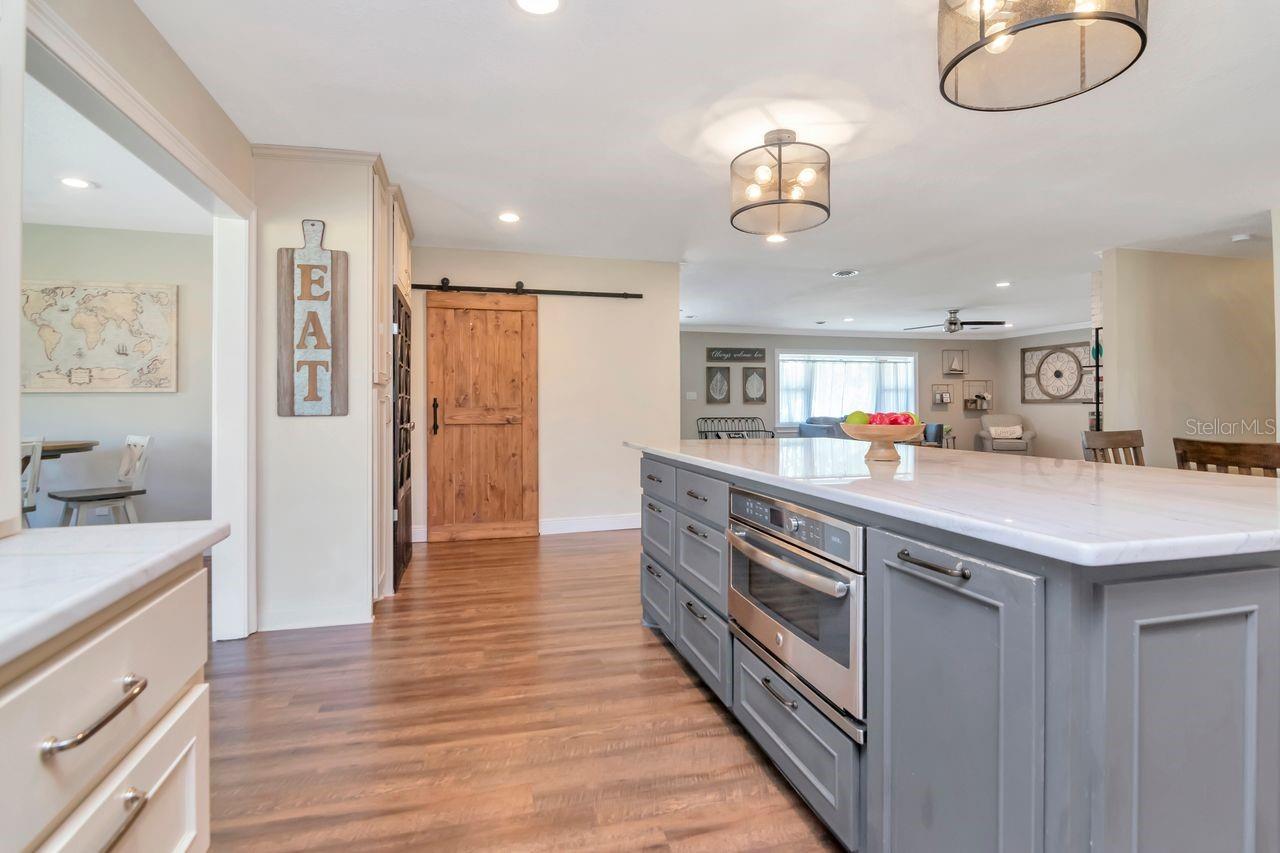 Kitchen Island and 2nd Barn Door Entry to Mud Room & Inside Laundry