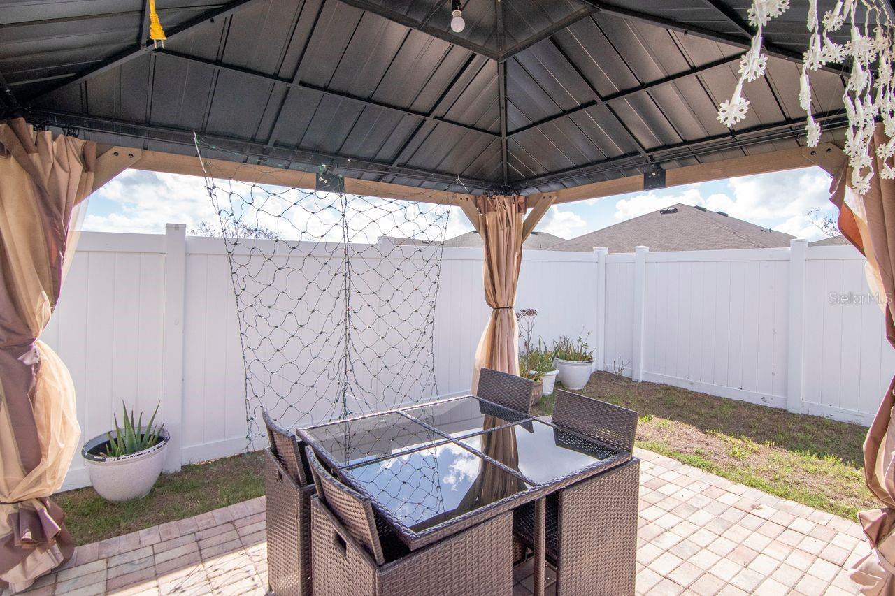 Beautiful pool with lighting and fountain features - pavered lanai and custom gazebo