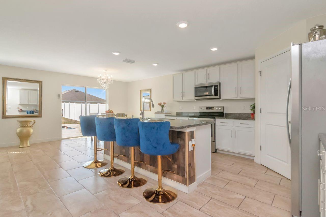 Open Kitchen with island, stainless steel appliances