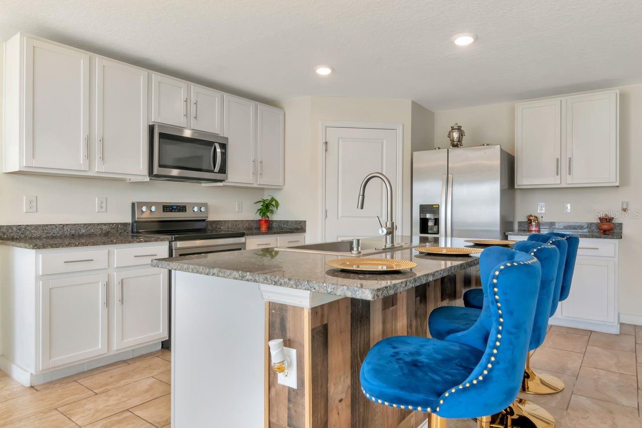 Open Kitchen with island, stainless steel appliances