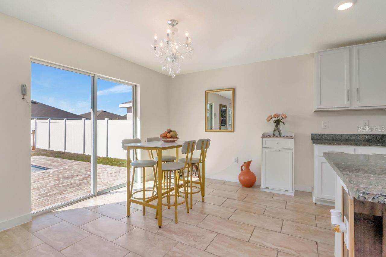 Eat in space off of kitchen that leads out to lanai and pool