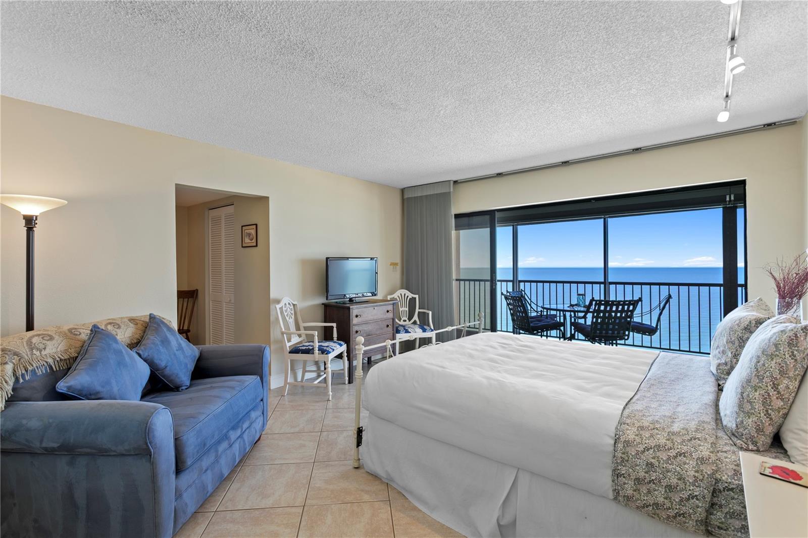 The spacious primary suite offers private balcony access, a generous walk-in closet with closet organizers, and an en-suite bath with dual vanities.