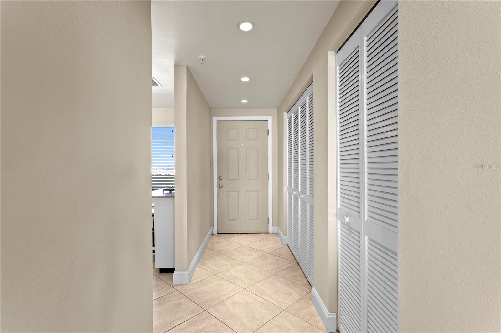 An in-unit laundry room makes cleaning up after beach days effortless, and additional pantry and storage space ensure everything has its place