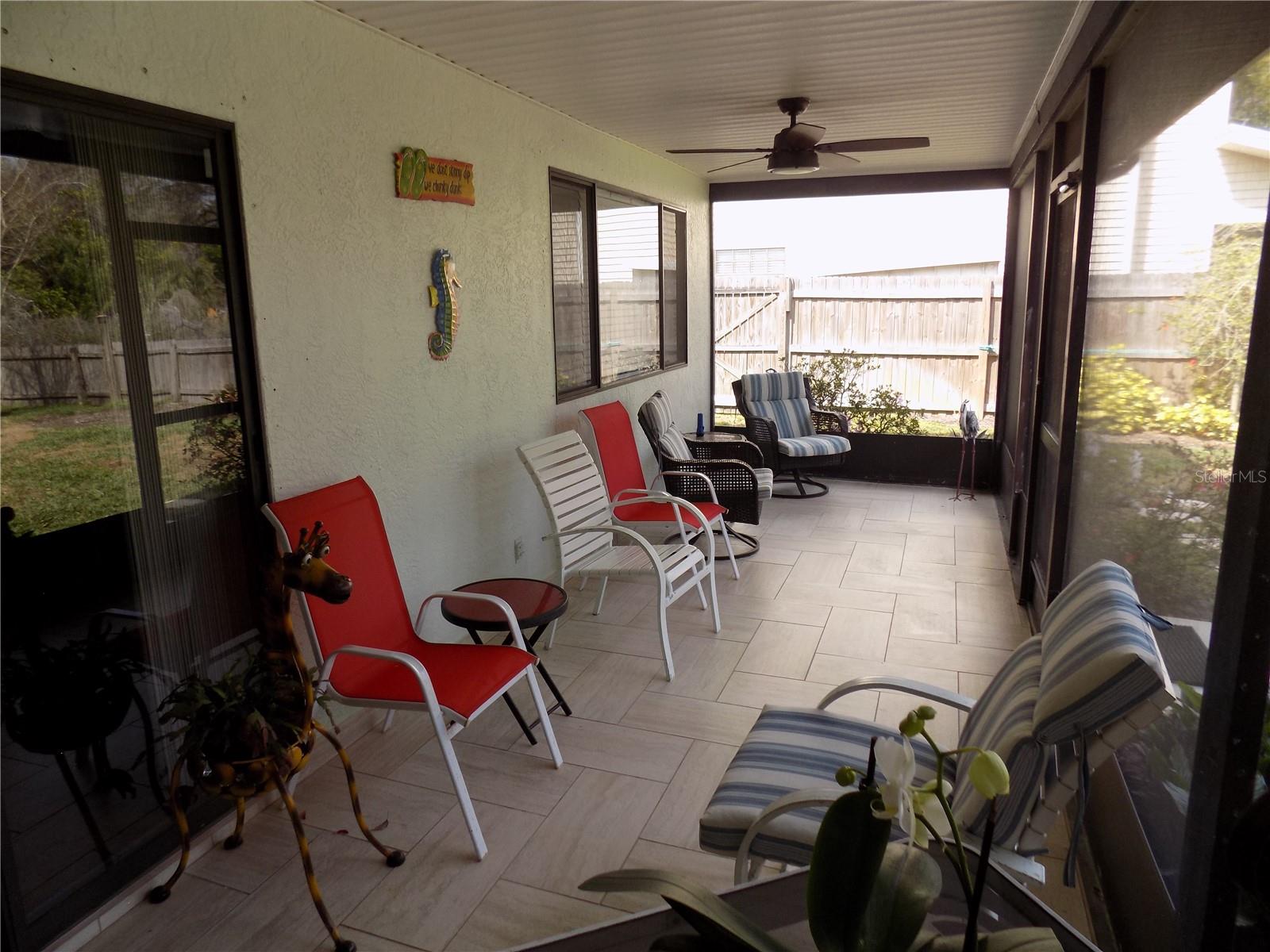 Tiled wrap-around rear screened porch