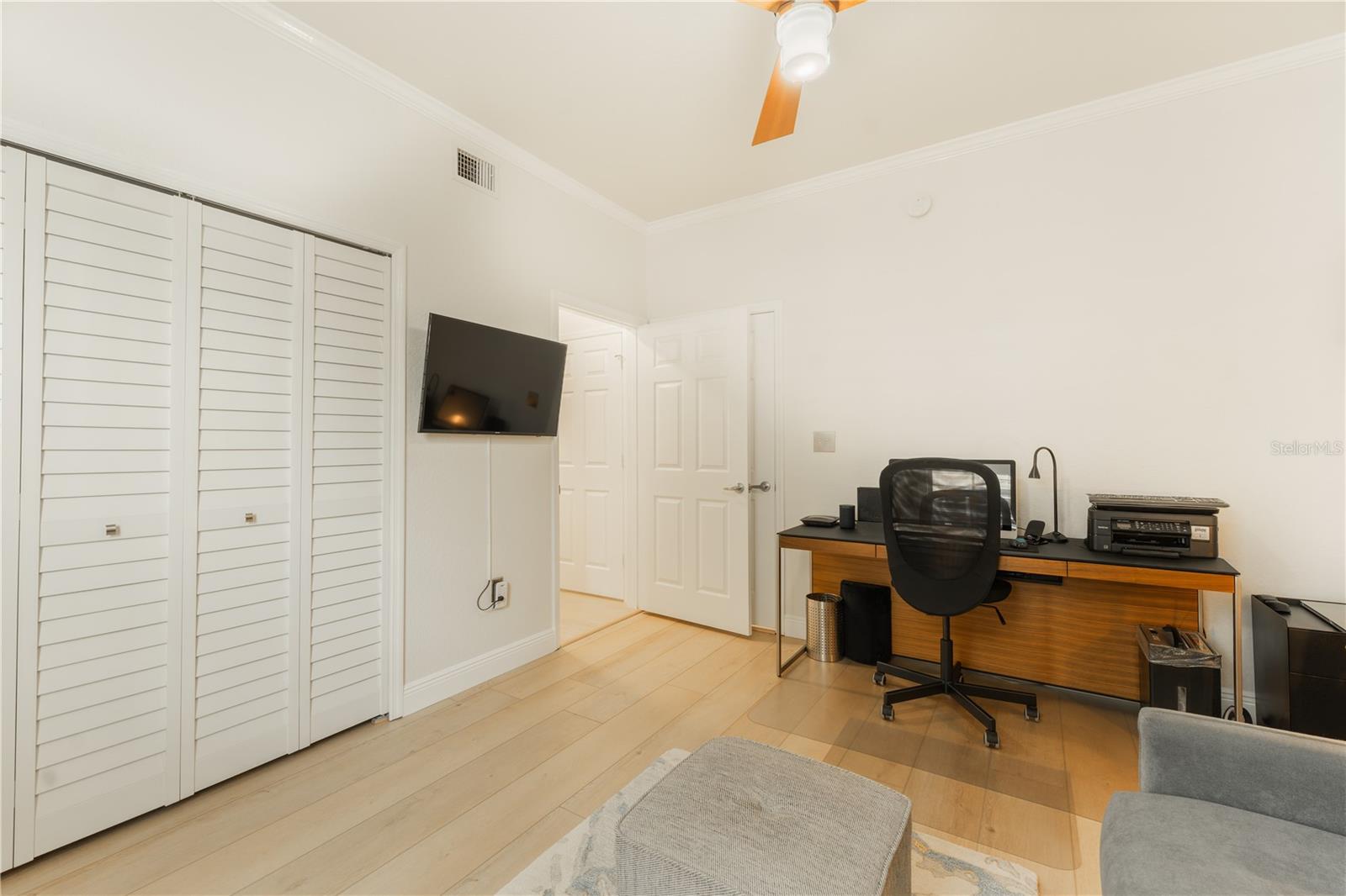 The second bedroom offers direct access to the second bathroom, making it an private and ideal retreat for guests.