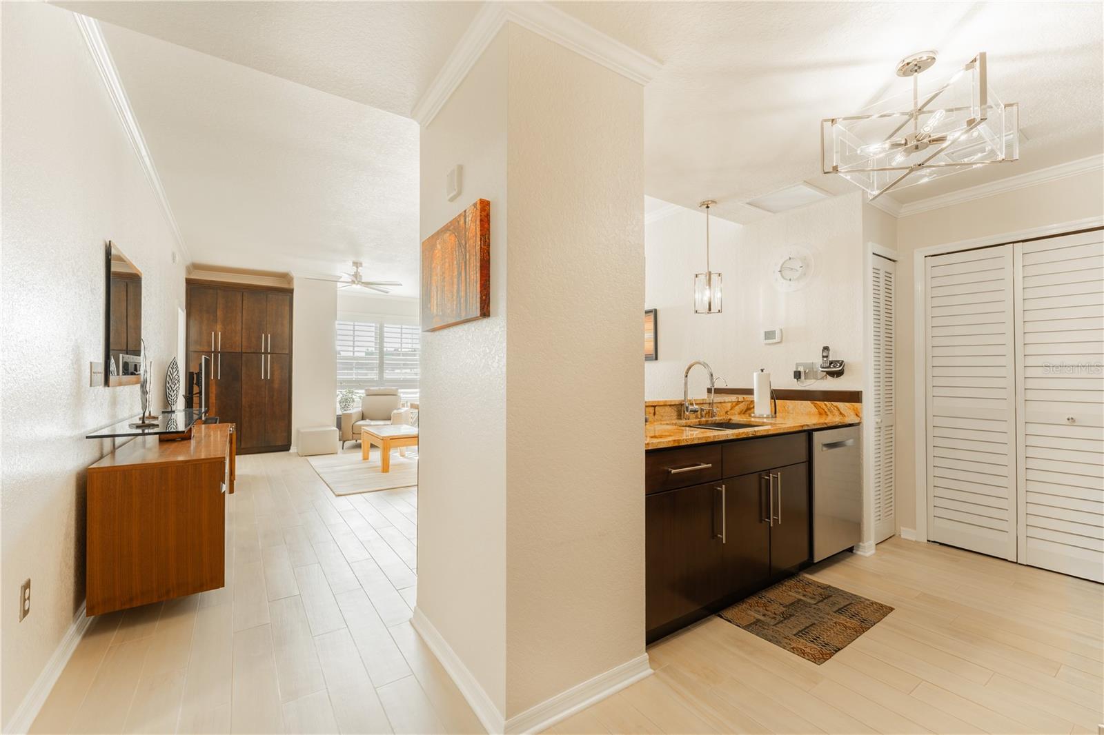 The open-concept kitchen, living, and dining area warmly greets you as you step into this beautifully updated home.