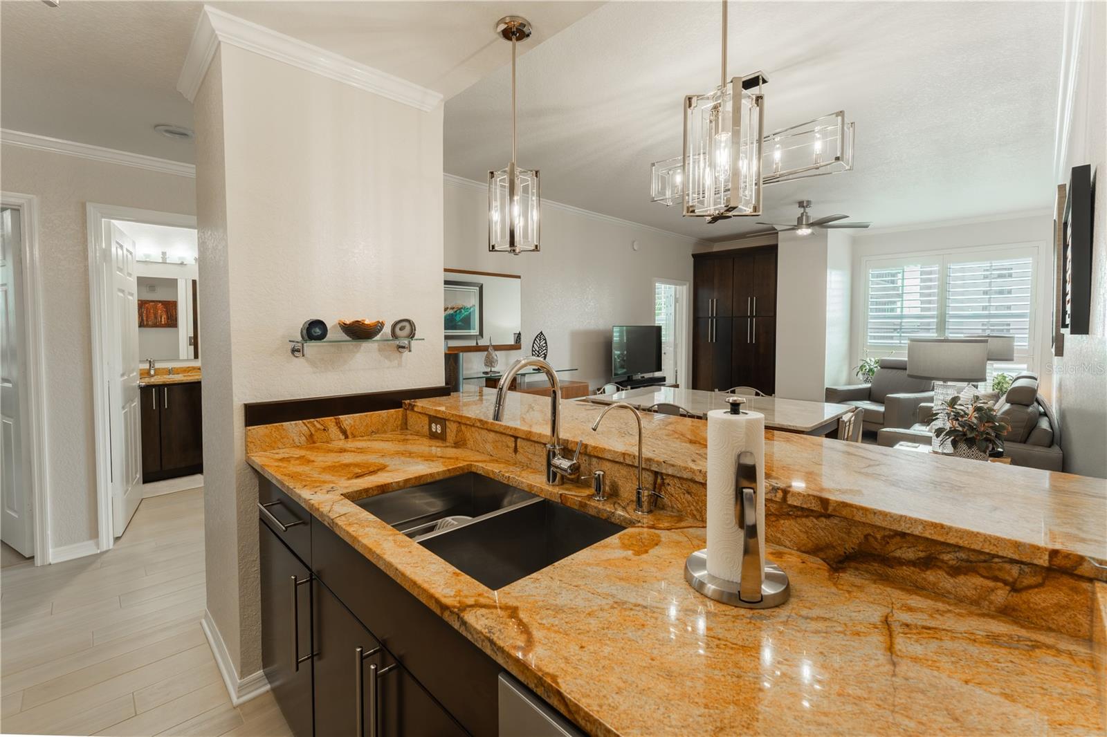 The updated, elegant kitchen and dining room lighting beautifully highlights the charm and sophistication of this space.