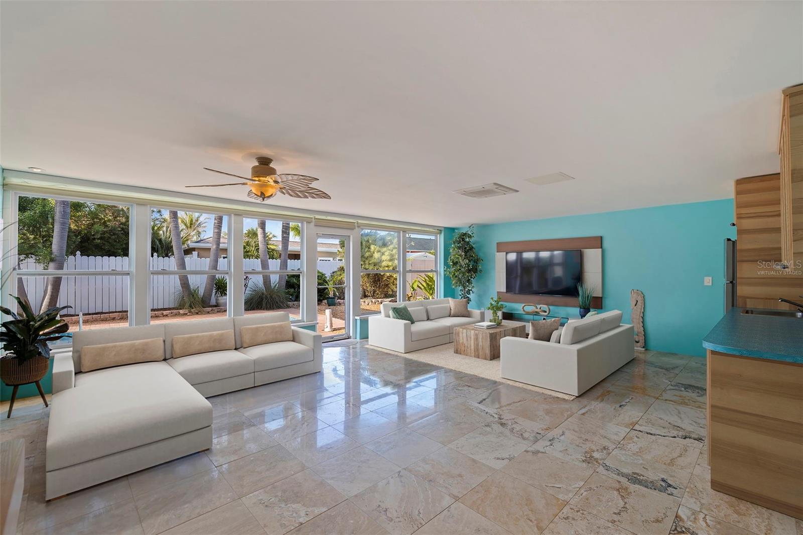 Virtually staged additional seating in Family Room.