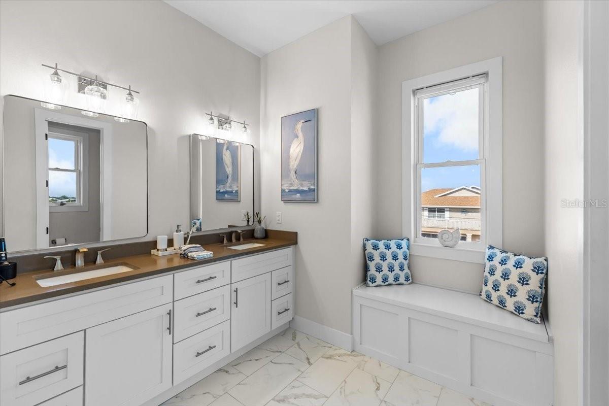 primary bathroom with storage bench