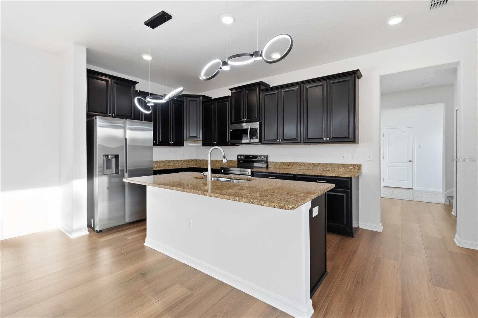 Wonderful eat in area in kitchen for your guests or family to be a part of the action in the kitchen.