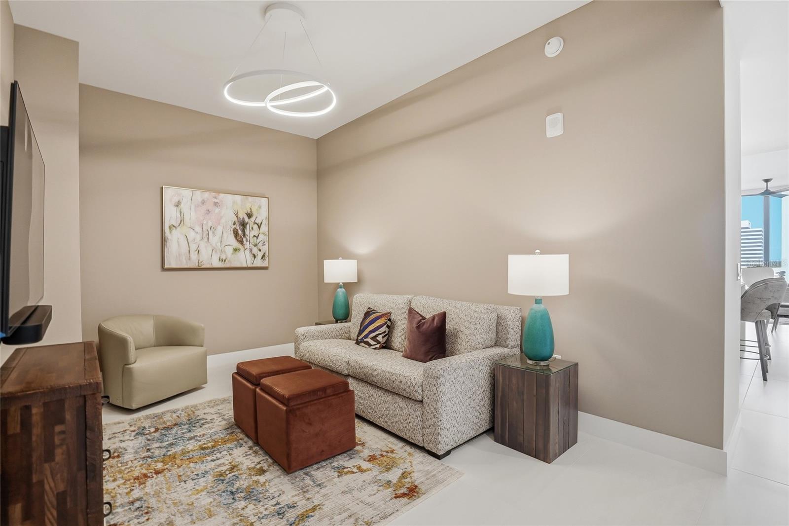 Flexible den perfect for a home office, media room, formal dining area, or additional guest space.