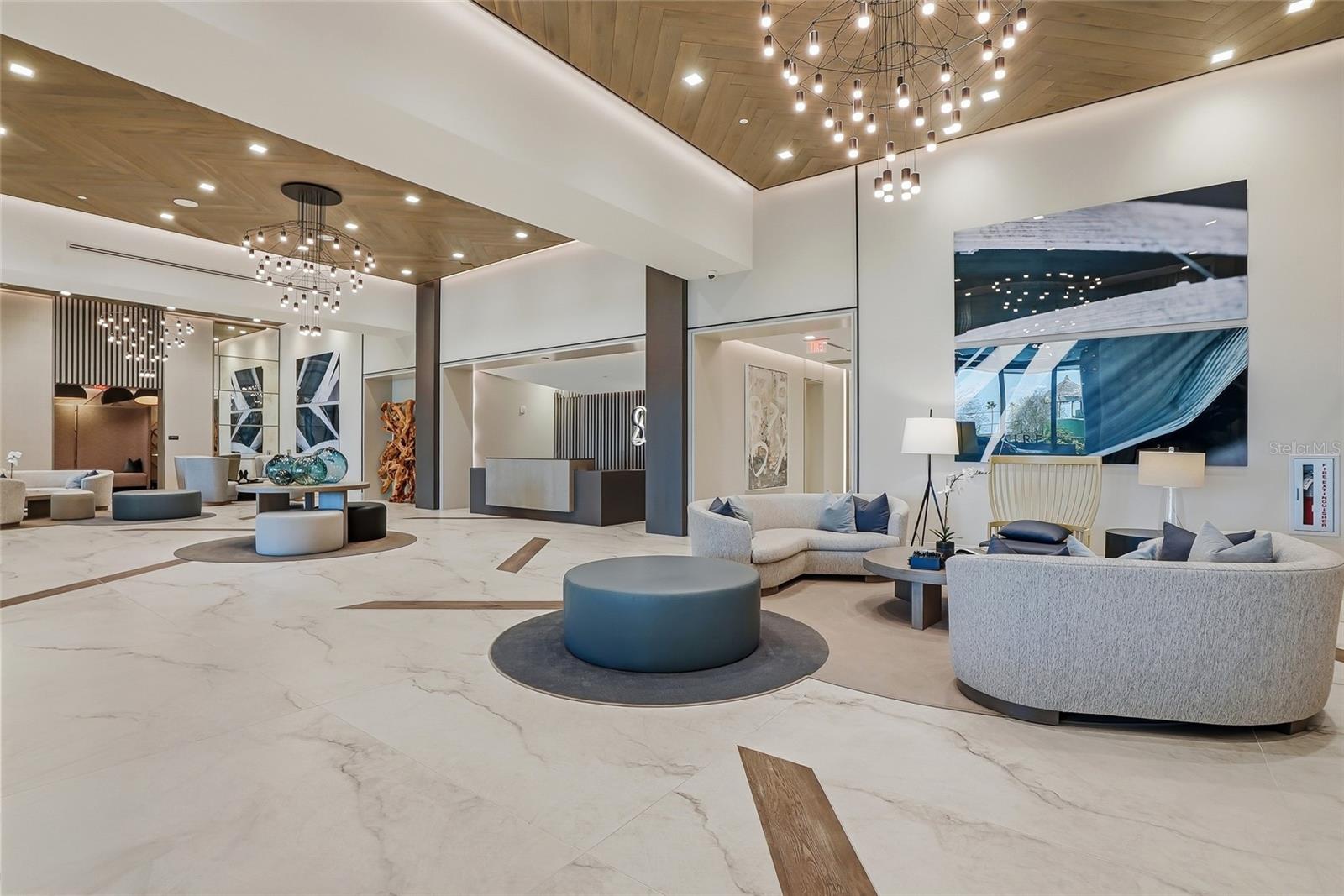 Grand lobby and exceptional amenities including a resort style pool, fitness center, resident lounges, conference space, concierge service, and dog park.