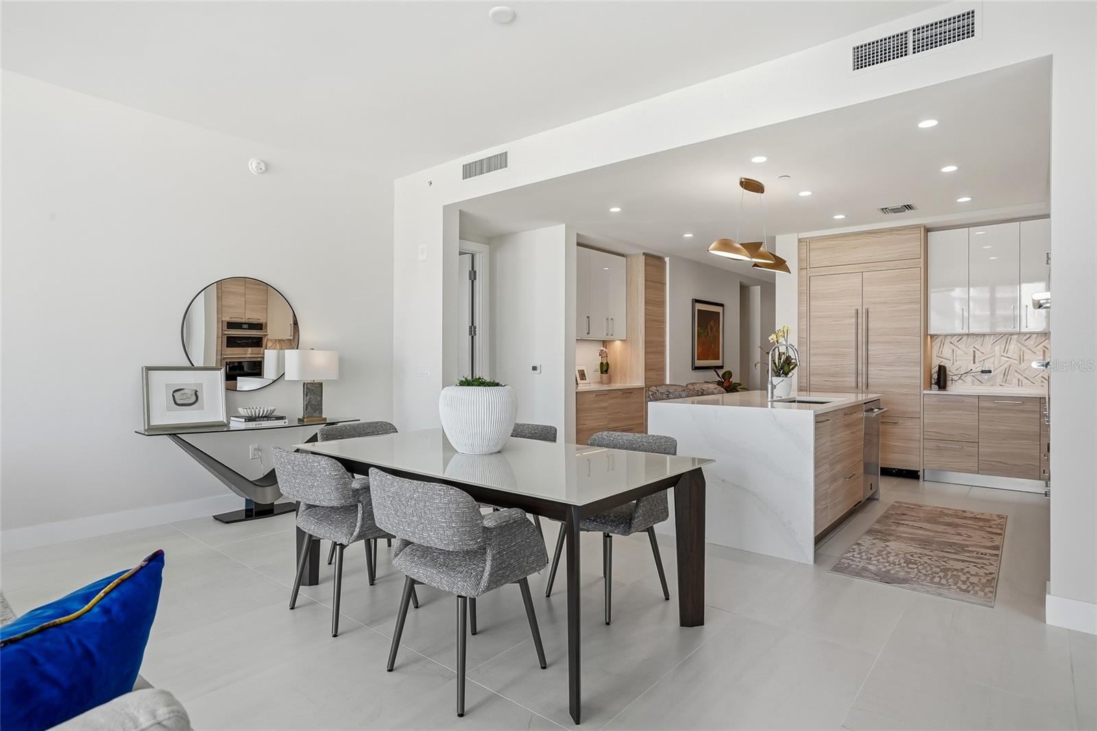 Seamless open concept living and dining spaces ideal for entertaining or relaxing in comfort and style.