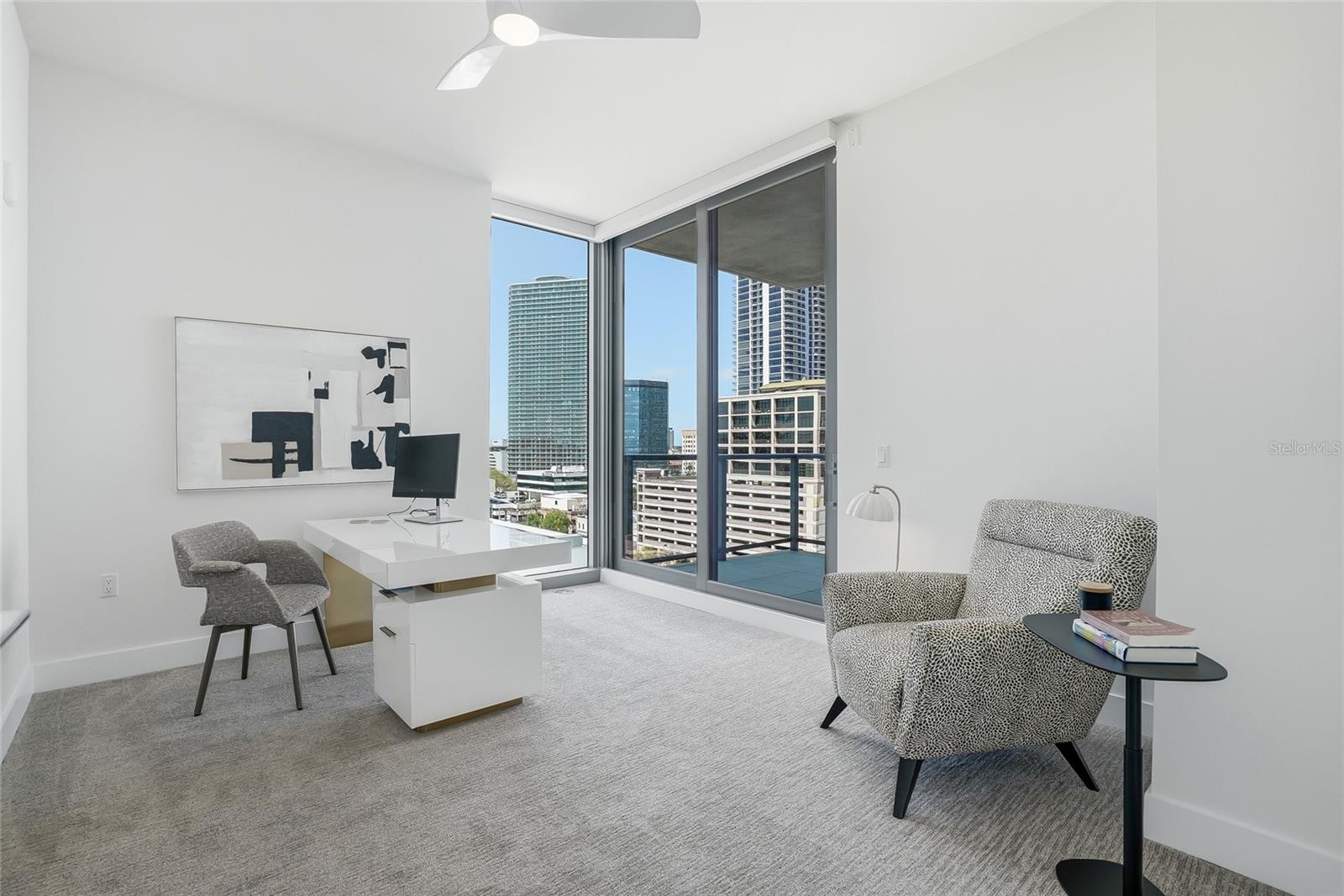 Versatile second bedroom currently set up as a home office, offering direct access to the second private terrace and plenty of space to comfortably function as a full guest bedroom with ensuite bathroom.