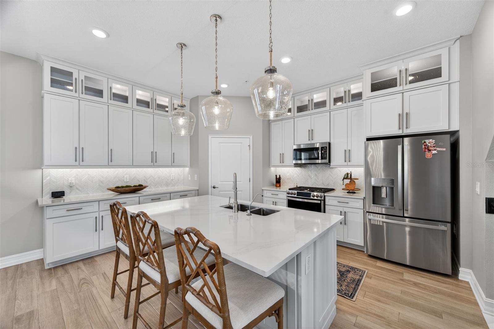 Quartz counter and marble backsplash