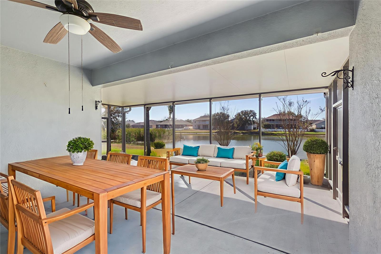 Enjoy your outdoor living space with an open view to the lake! Virtually staged