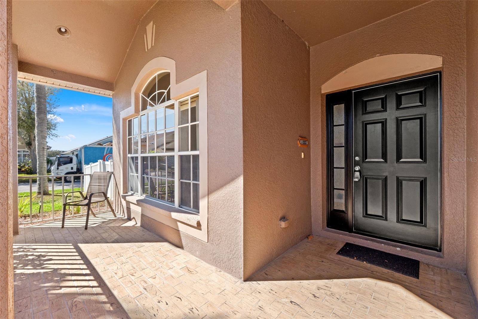 Tiled Front Porch just waiting for you to relax