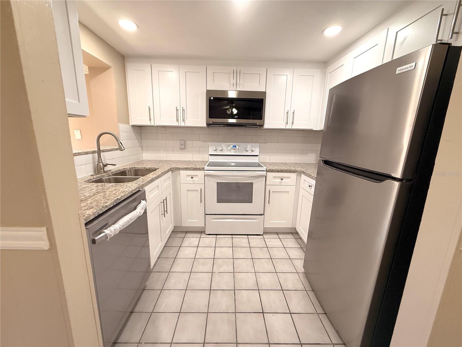 Must see!  New kitchen cabinets and granit counters.