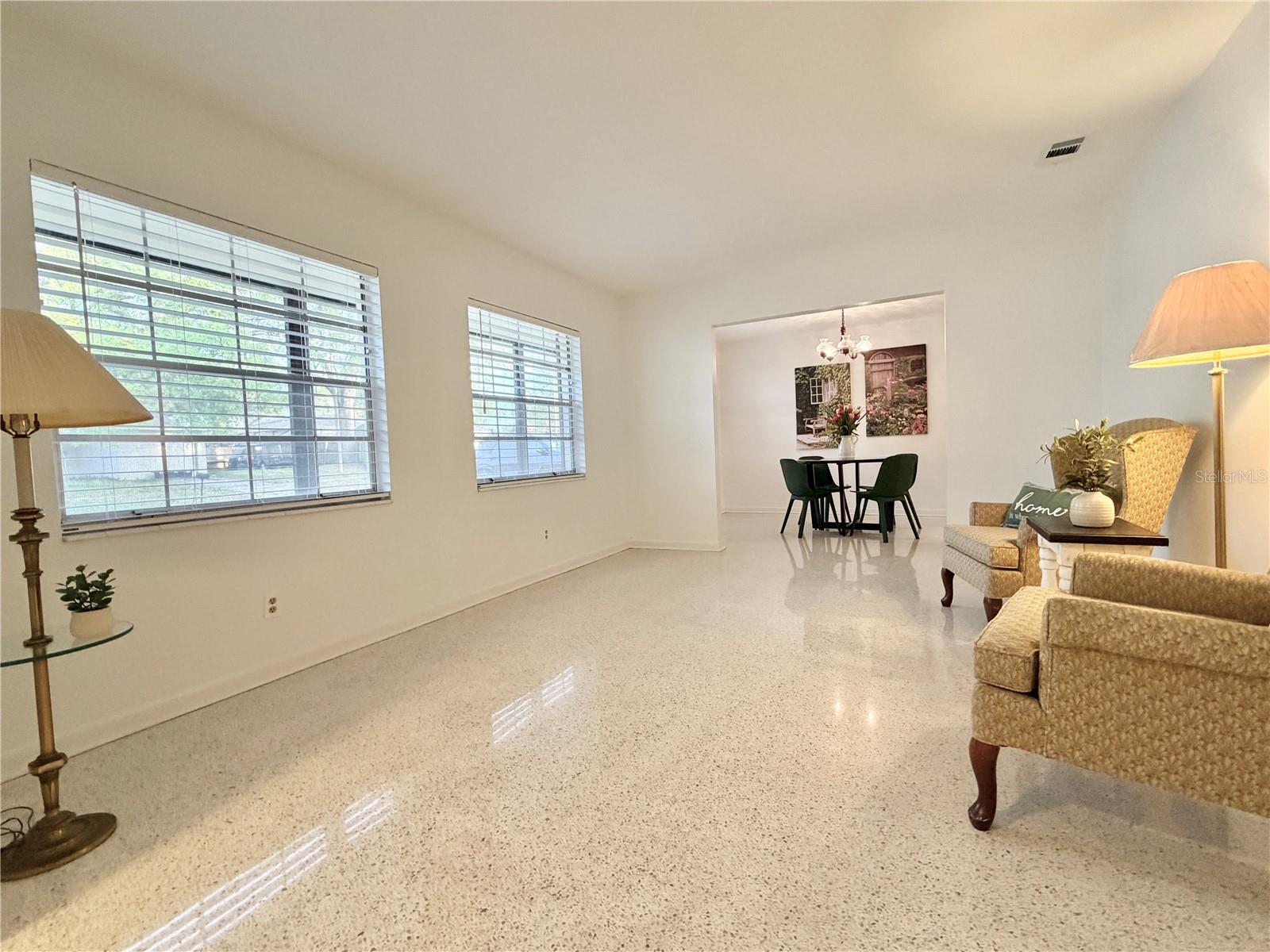 Front living room with terrazzo floors.