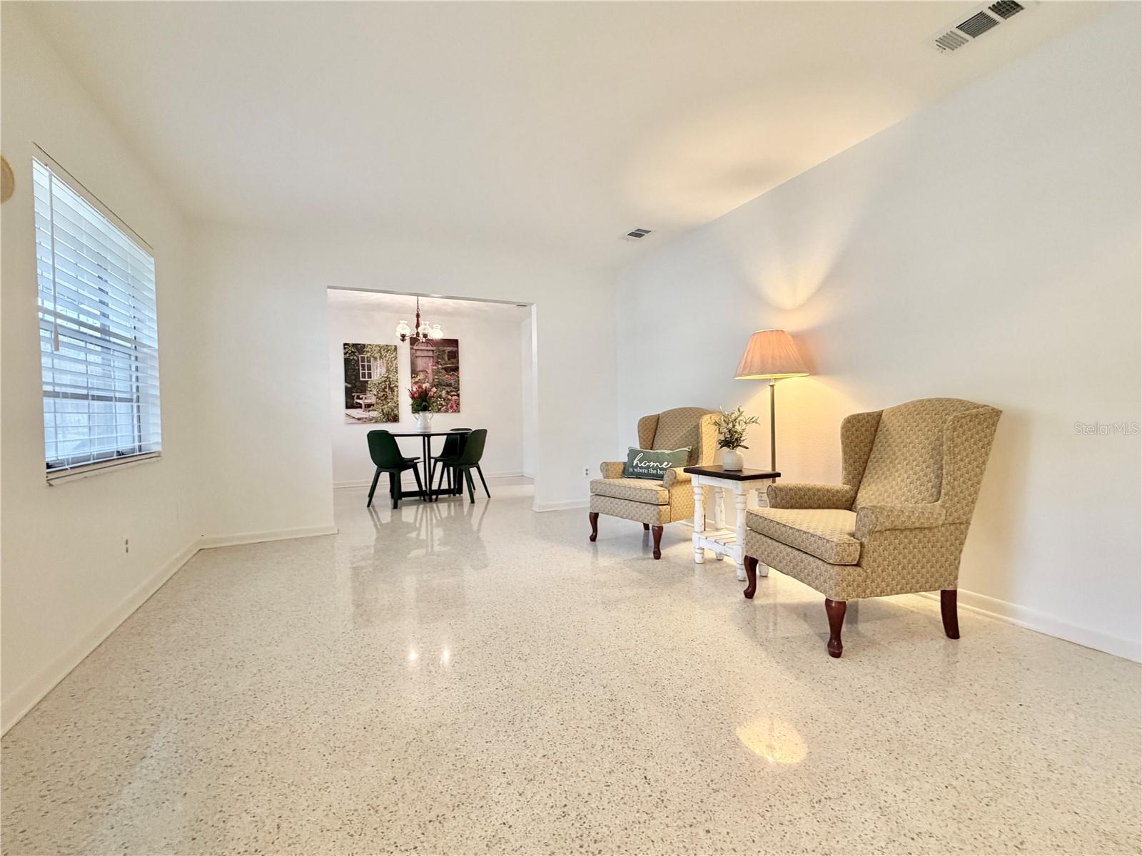 Front living room with terrazzo floors.
