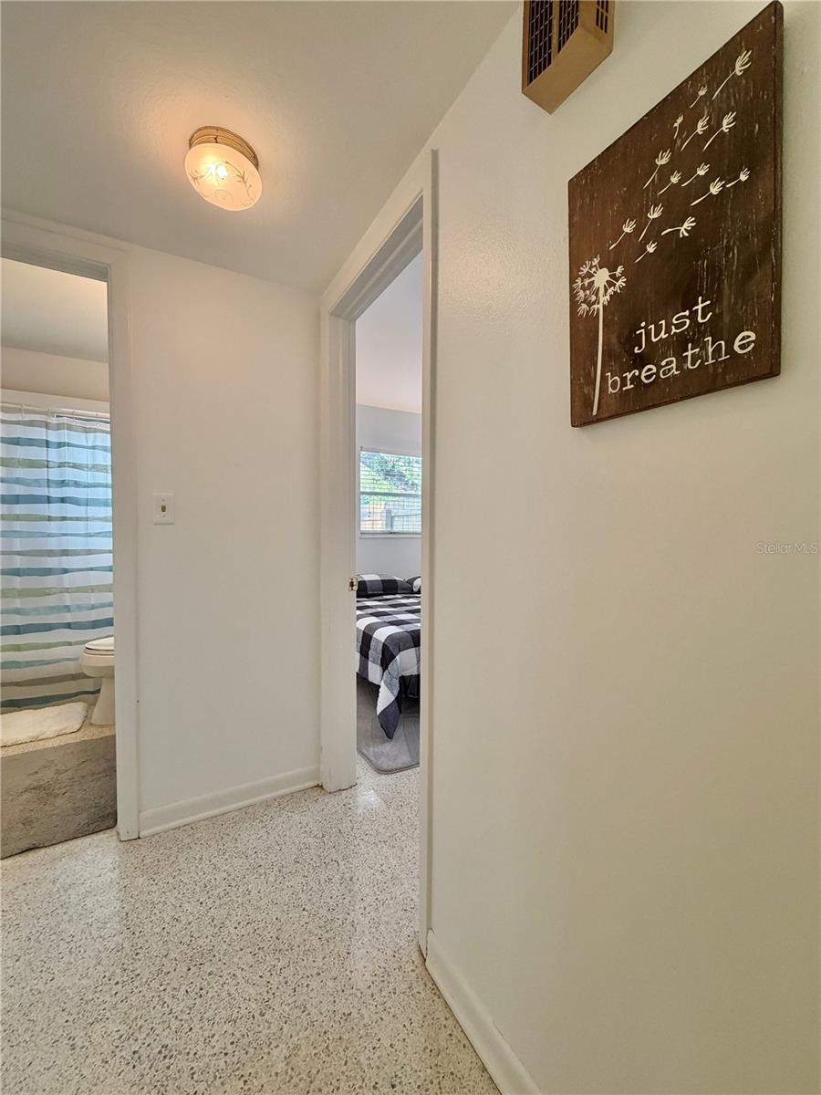 Hallway to 2 bedrooms downstairs.