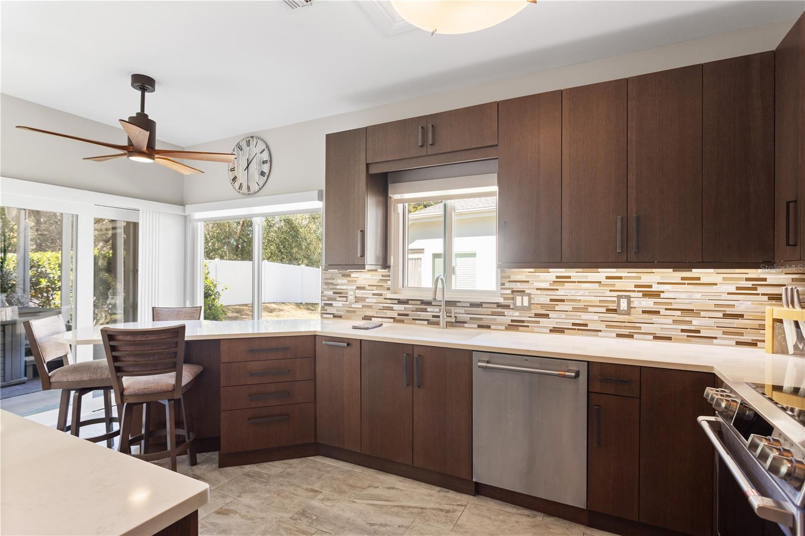 Custom Kitchen with High End Cabinetry, Stainless Steel GE Cafe' Appliances and Quartz Countertops