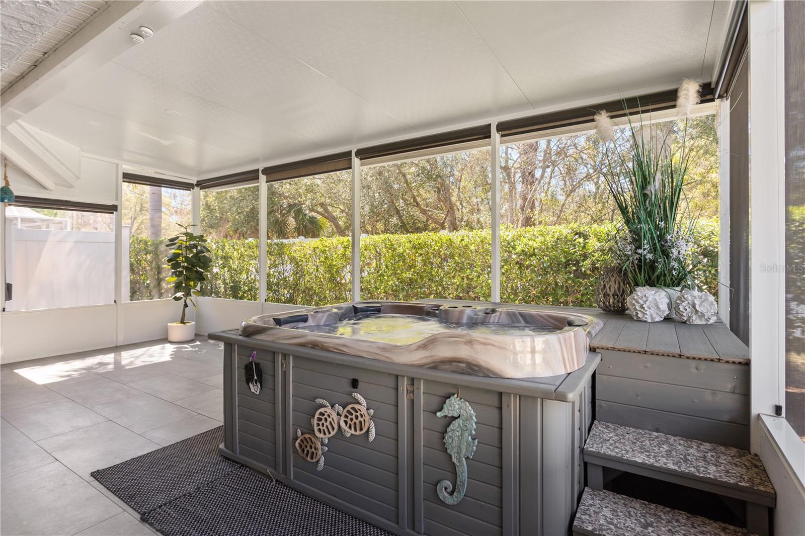 Covered Lanai with Custom Automated Outdoor Shades and Hot Tub