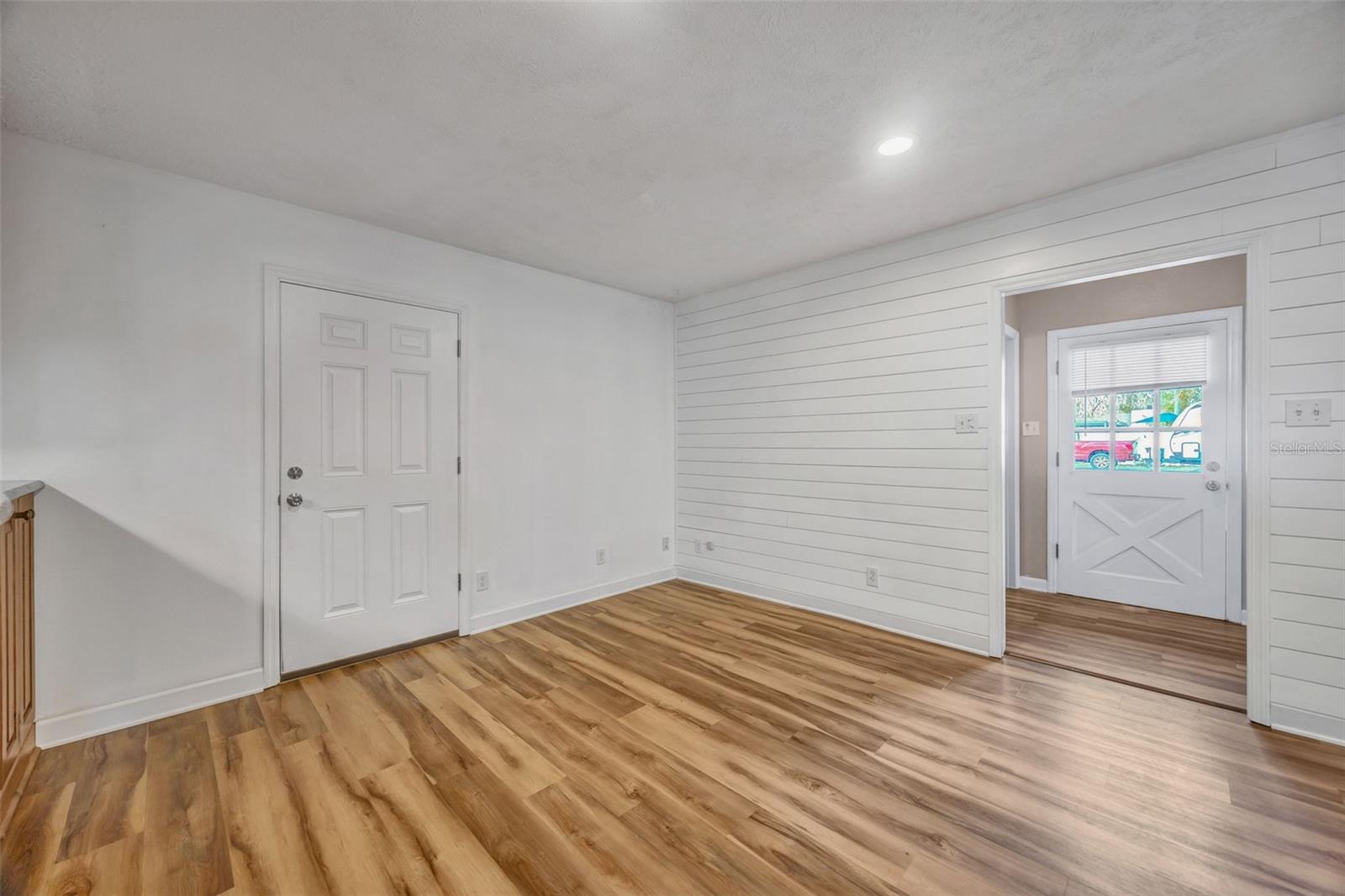 Family lookin toward 3rd bath and utility