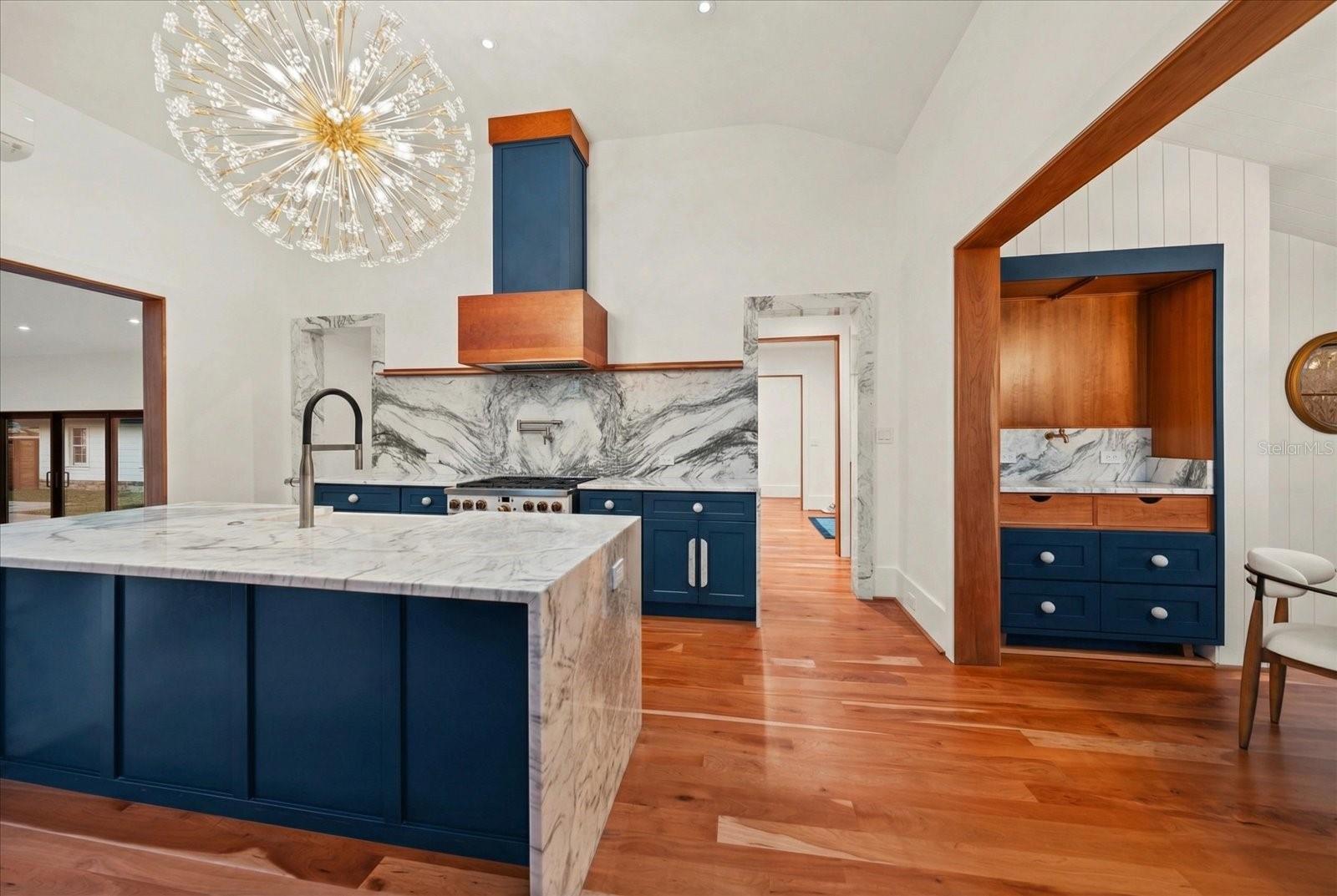 Marble island with seating. Dining room custom coffee/tea station