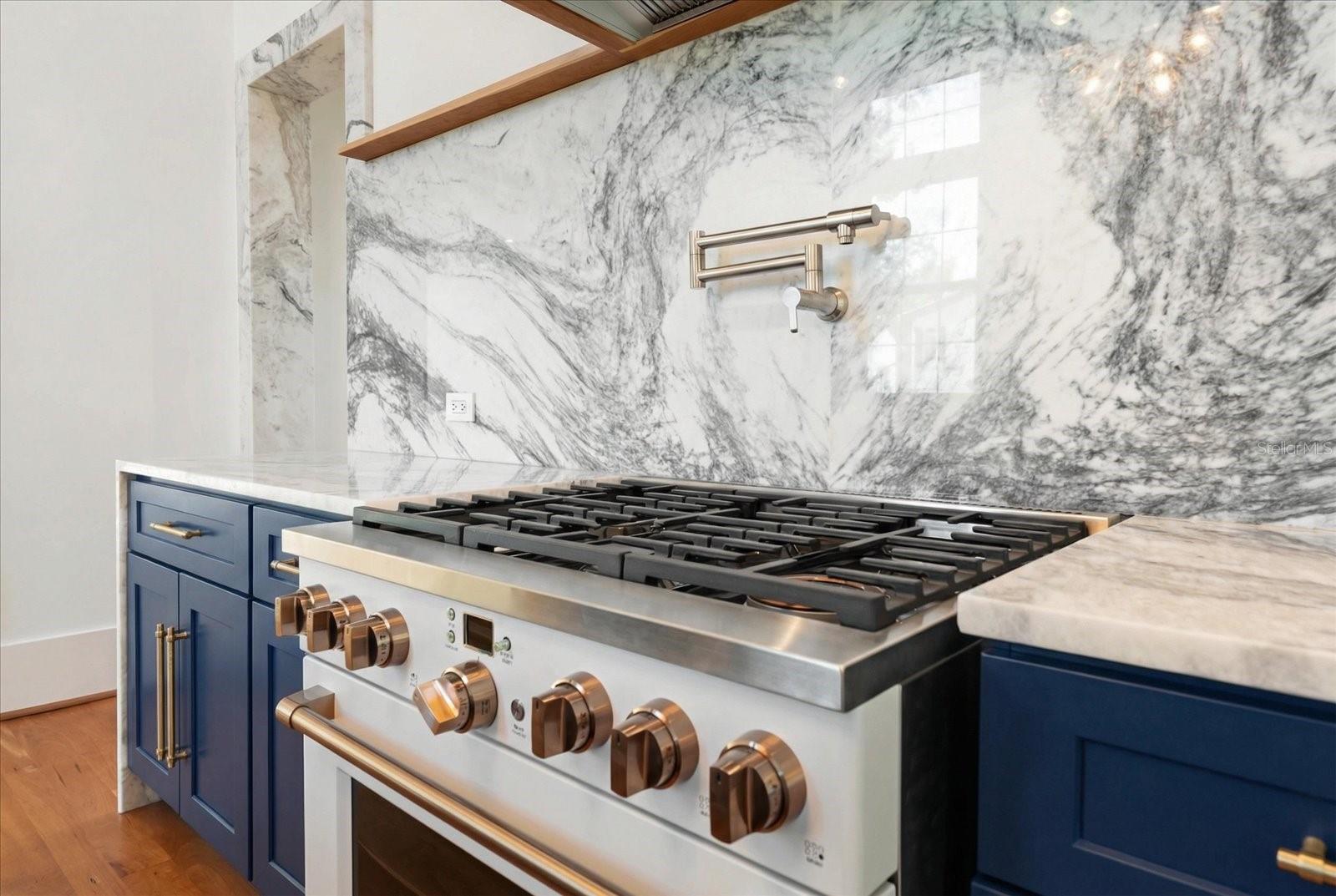 Kitchen GE Café 6 burner range, marble backsplash, pot filler