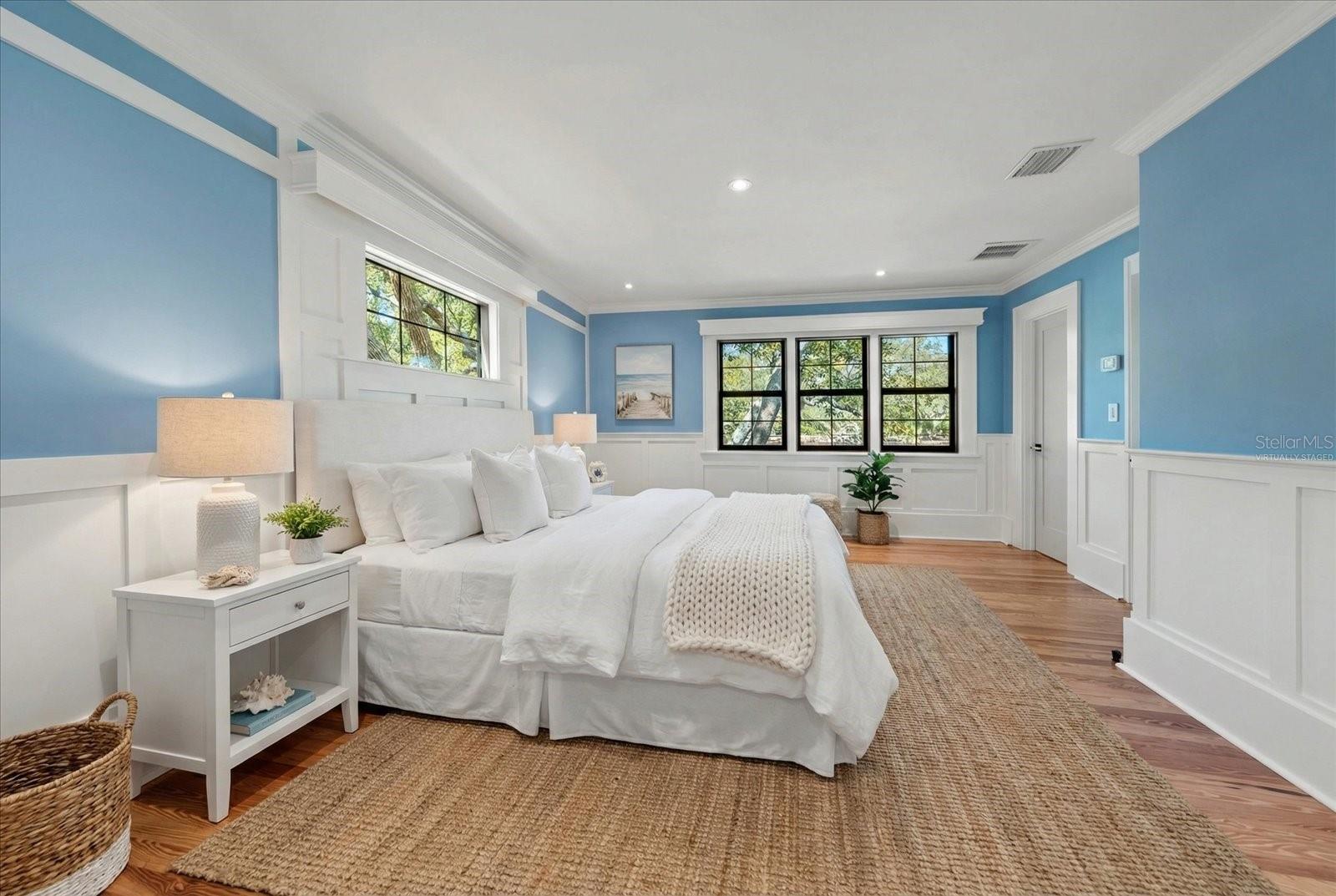 Bedroom #3 with en suite bath, shaker wall panels, custom wood window valances, walk in closet. Virtually staged