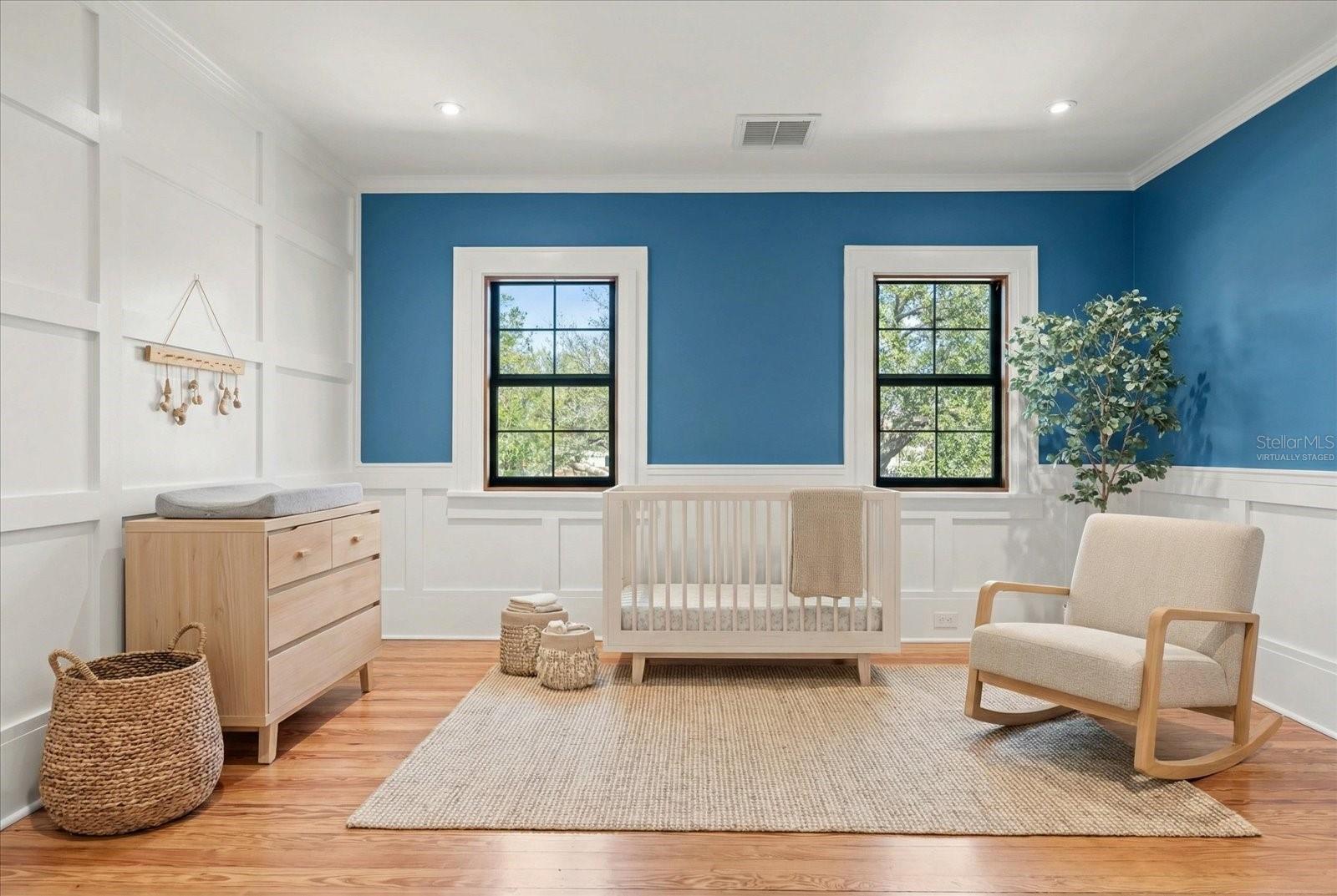 Bedroom #4 with shaker accent wall and wall panels, crown molding, large windows, and walk in closet with custom built in drawers with marble countertop.  Virtually staged
