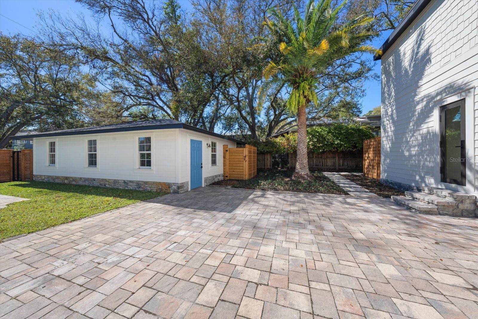 Oversized 2 car garage with new shingle roof, garage door opener, alley access.  Pool equipment fenced in.