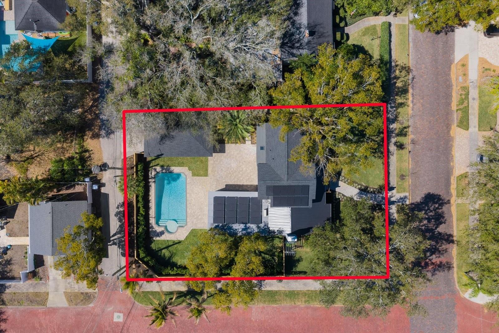 Aerial view of property, corner lot, brick streets, alley access