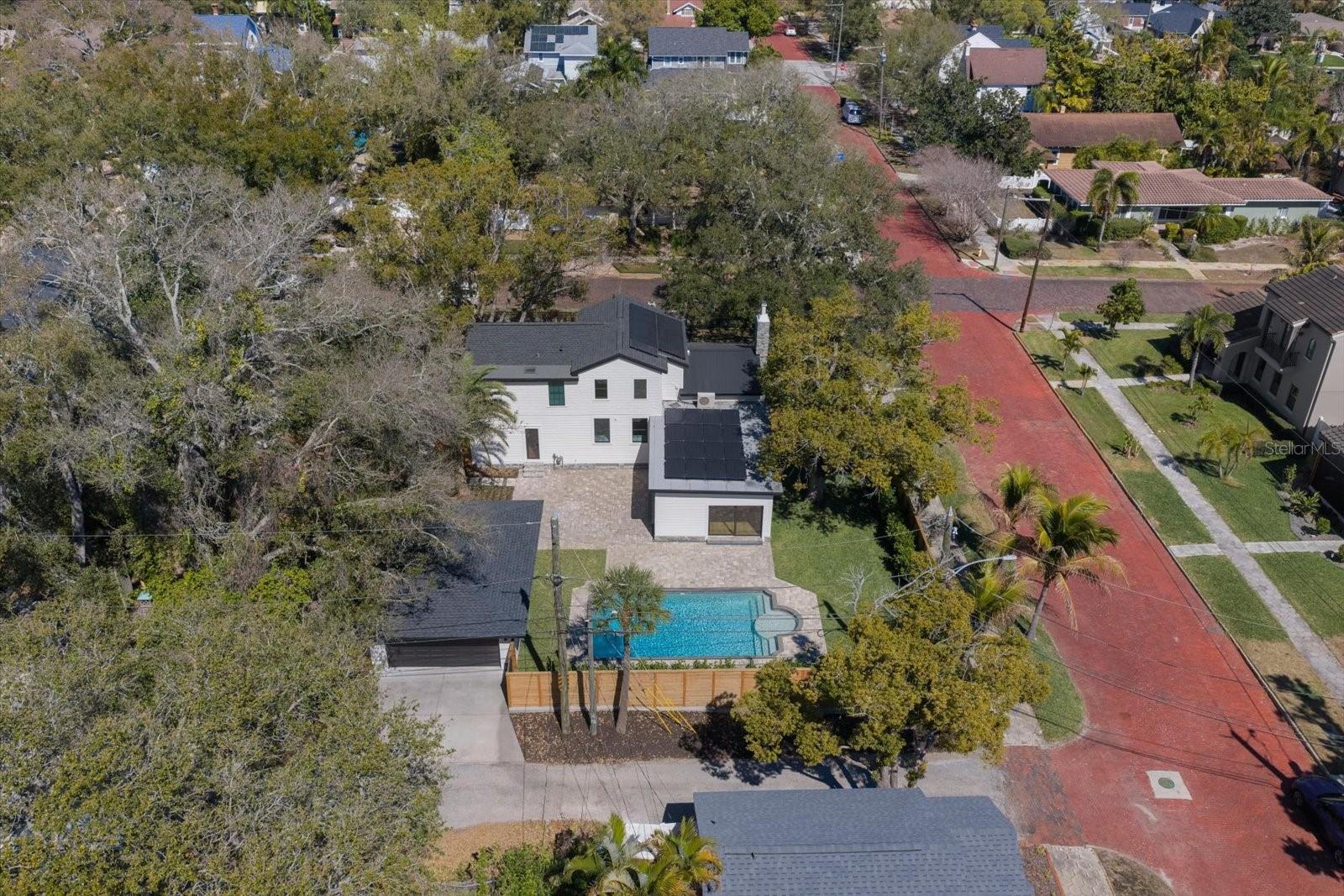 Aerial view of south side of property. Alley access, corner lot.