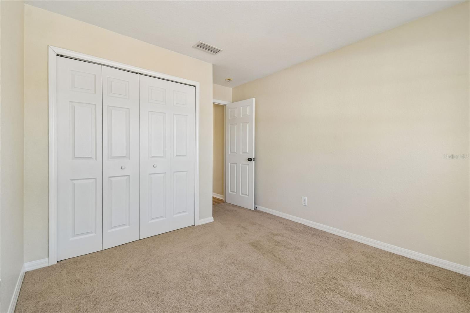 Flexible secondary bedroom with ample closet space and a layout designed to evolve with your needs.