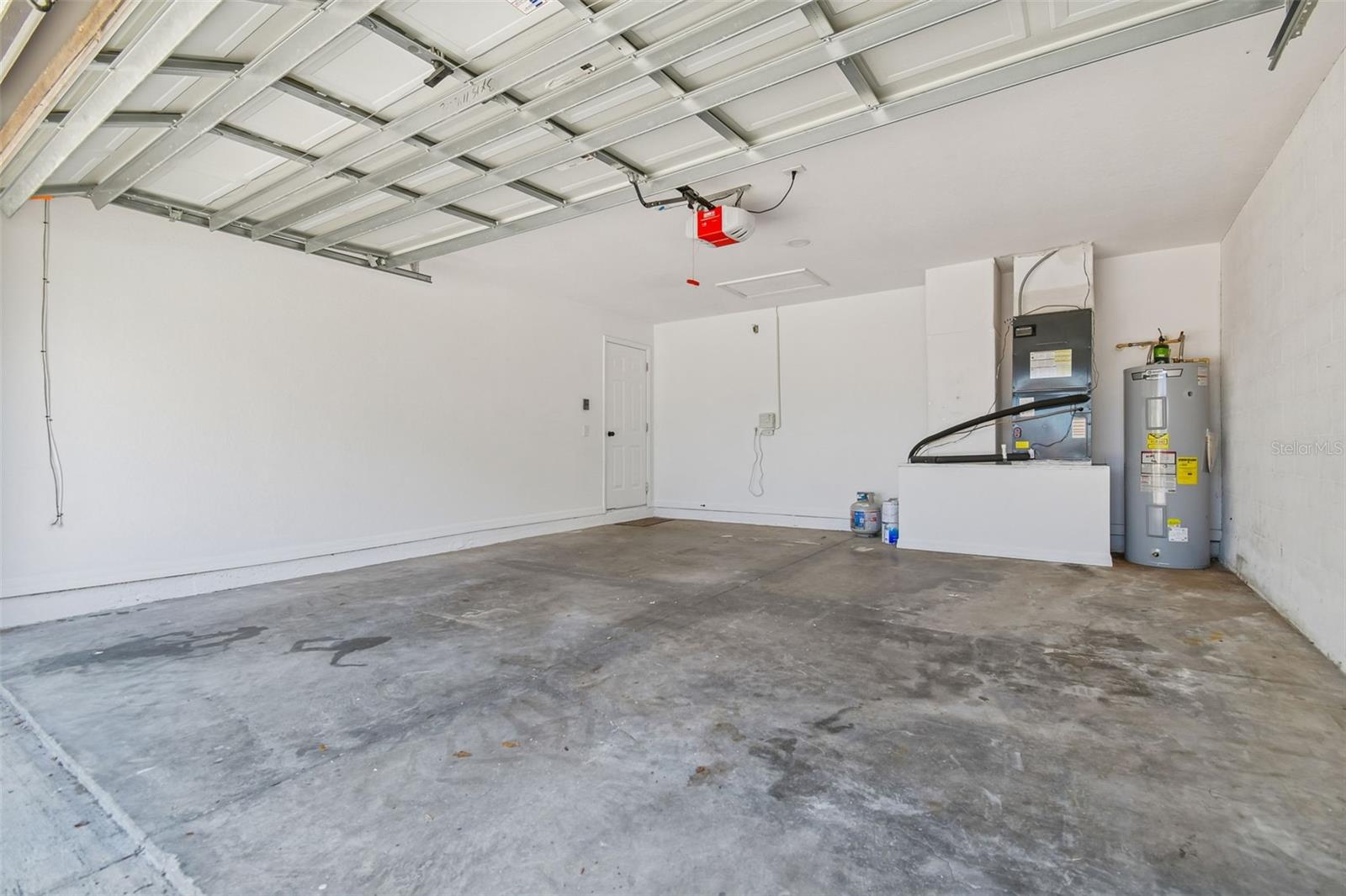 Spacious two car garage with additional storage area