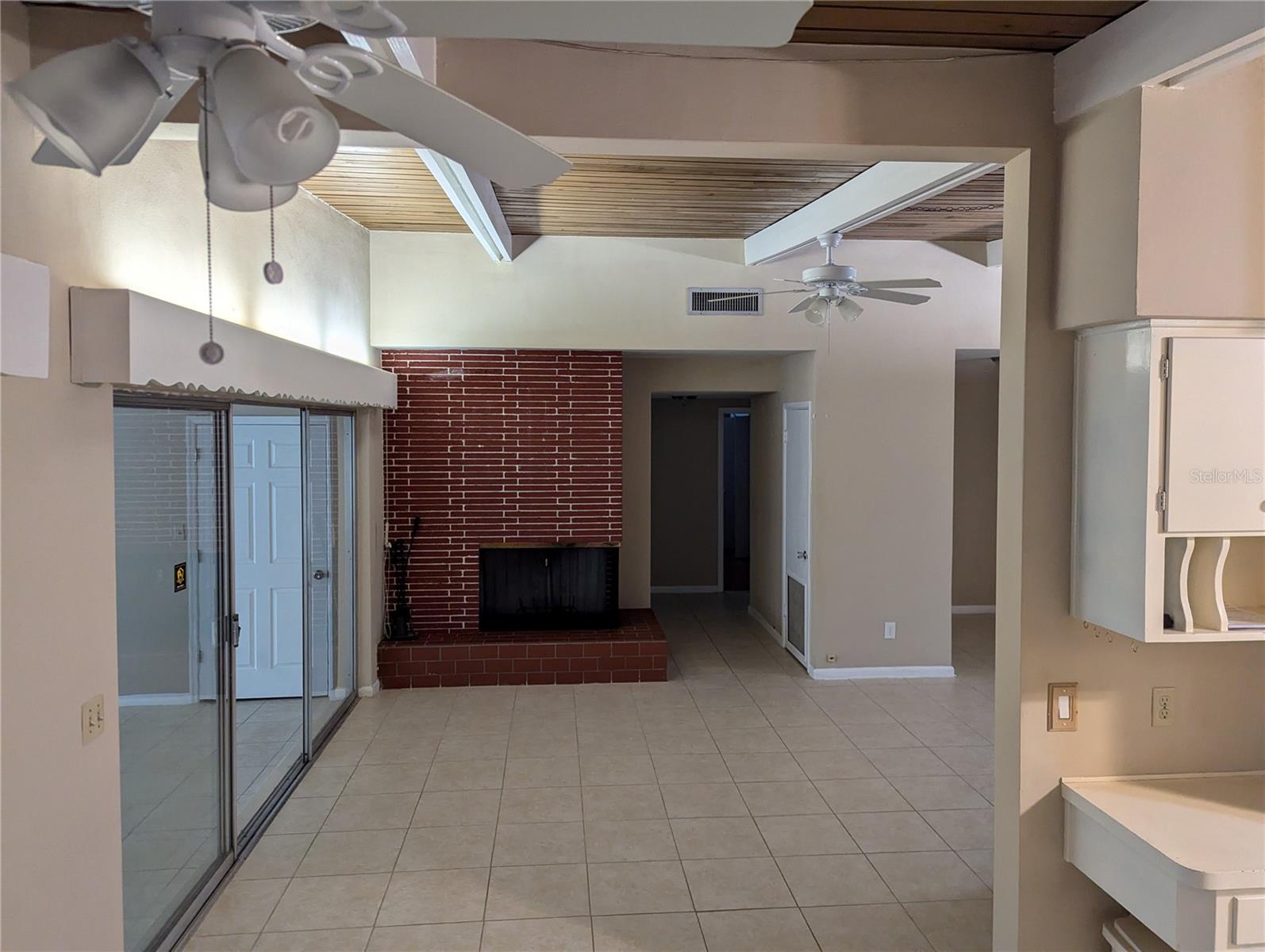 Dining Area to Living Room / Hall with Wood Burning Fireplace! W. View