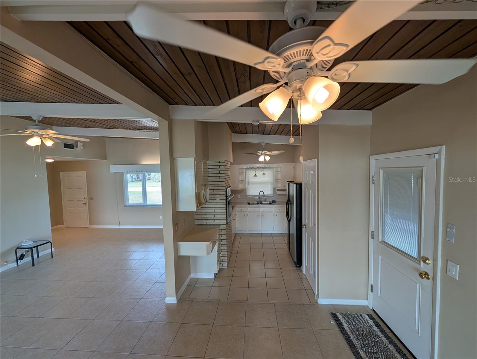 Living Room / Kitchen View From Dinning Area W/Side Carport Door