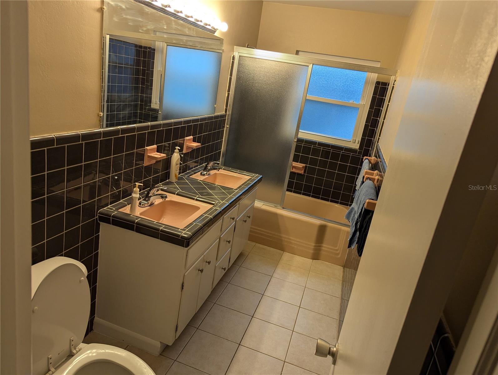 Hall Bath with His and Her Vanities